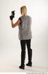 NIKOL STANDING POSE WITH TWO GUNS